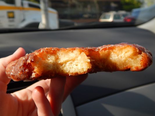Cross-section of an apple fritter showing the airy interior and cinnamon swirl