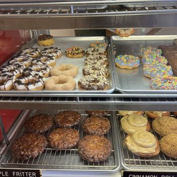 A box of glazed mochi donuts, fresh from the case